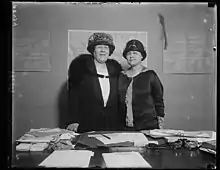 Two women standing side be side