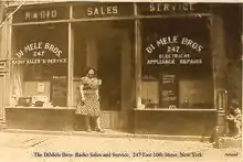 Armand at his parent's radio store (5 years old)