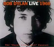 A close-up black-and-white photograph of Dylan's face