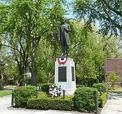 Statue of Andrew Curtin located centrally within the neighborhood