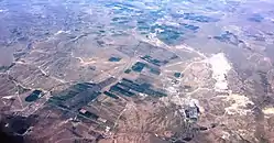 Aerial view over central parts of the county, with agriculture and Guangmingcun open-pit mine.