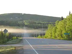 Chena Hot Springs Road runs through the CDP for 11.6 miles (18.7 km), from its intersection with the Steese Expressway to its crossing of the Little Chena River. This view looks eastbound at the intersection of CHSR with Nordale Road.