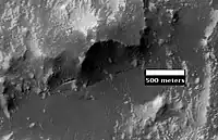 Claritas Fossae as seen by HiRISE. Note the steep scarp.