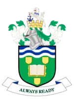 Coat of arms: knight's helmet above shield containing open book, motto "always ready" below.