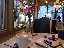 Image 7A cup of coffee with cheesecake at a cafe in Helsinki, Finland (from Coffee culture)
