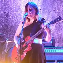 Tucker performing live with Sleater-Kinney in London, 2015