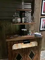 Bar in escape room themed as Ryan Reynolds's office on distillery tour