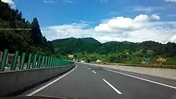 Westbound G56 Hangzhou–Ruili Expressway in the county at the 1,414 km (879 mi) post