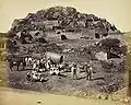 General view inside Fort, with Europeans and party posed in the foreground, Chitradurga