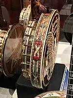 Decorated back and side of a Gibson All American banjo (1969).  Highly decorated with carvings, engravings and gold