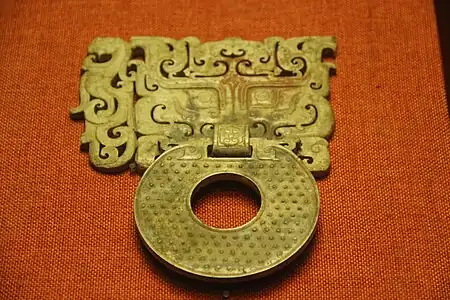 Ornamental handle with a bi disc; c.100 BC; jade; 18 x 14 cm; Museum of the Mausoleum of the Nanyue King (Guangzhou, Guangdong, China)