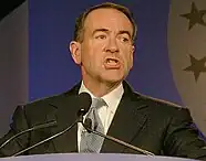 Huckabee speaking at a lectern