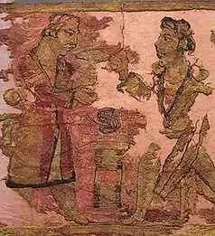 Figures in the embroidered carpets of the Noin-Ula burial site, made in Bactria and proposed to represent Yuezhis (1st century BC – 1st century AD).