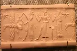 God with ax attacks eagle while Shamash and Worshipper stand behind