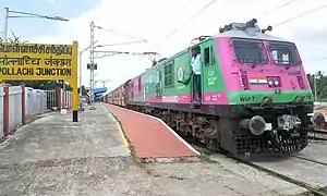 WAP-7 holding the Palani-Coimbatore-Palani Express at Pollachi Jn