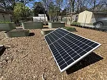 Photovoltaic solar panels provide clean electricity for this land lab. Using local power to operate garden tools, sensors, cameras, and water pumps provides a great example of sustainable energy for students.