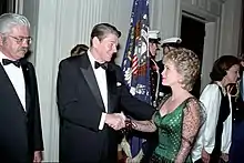 Barbara Mandrell shaking hands with President Ronald Reagan.