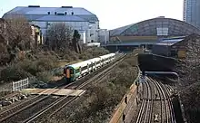 Lillie Bridge Depot shed to the right against Earls Court Exhibition Centre