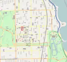 a street map with a portion of a block designated with red borders. The map also has several large green areas designating undeveloped land.
