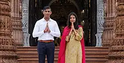 Rishi Sunak, the Prime Minister of the United Kingdom, and his wife Akshata Murty, with Namaste greetings, at Akshardham Temple, New Delhi