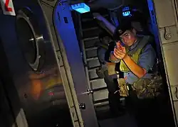 A Royal Brunei Navy sailor watch as passageway aboard USCGC Mellon (WHEC-717) during CARAT 2010.